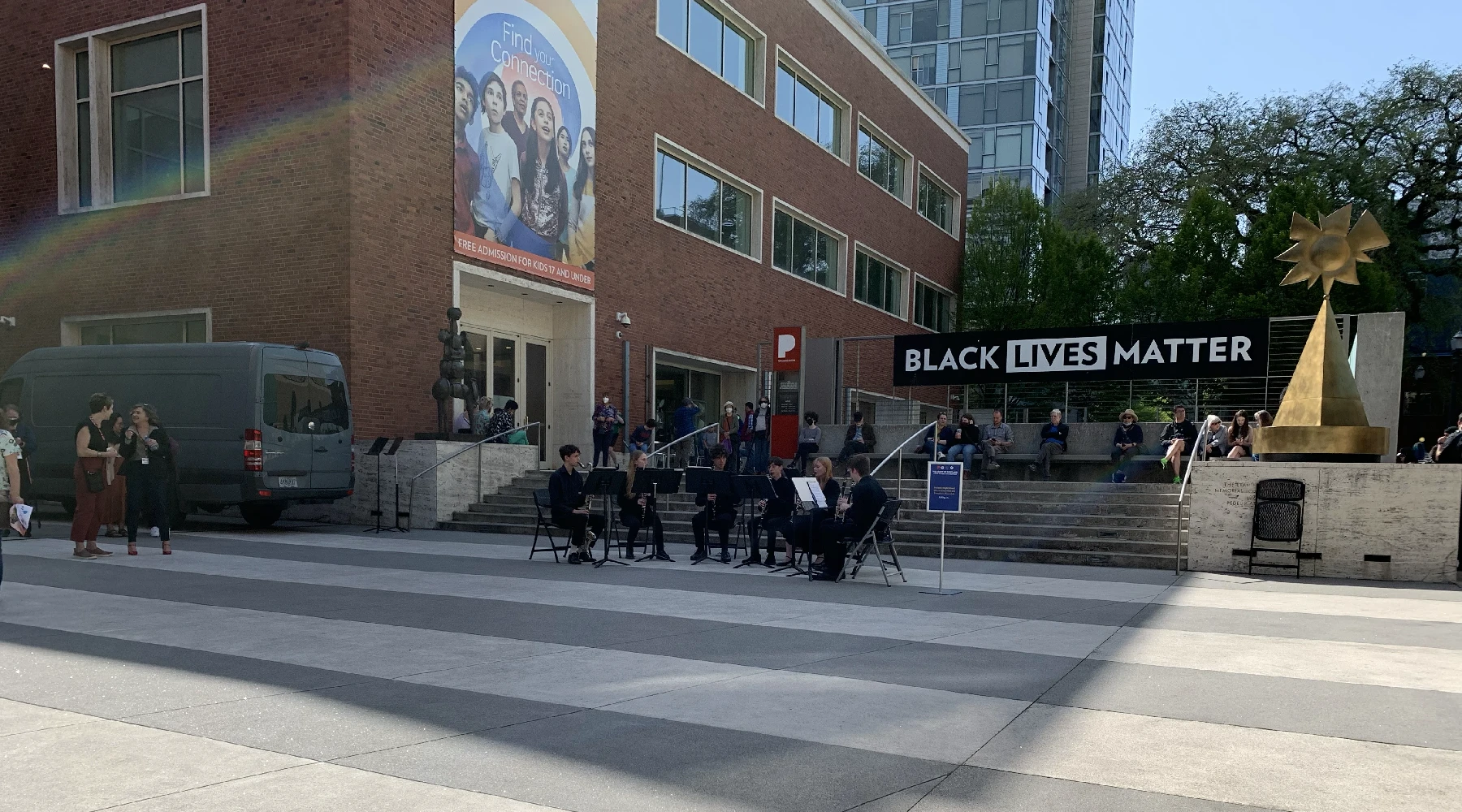 A street in downtown Portland with a small orchestra playing to commemorate Black Lives Matter