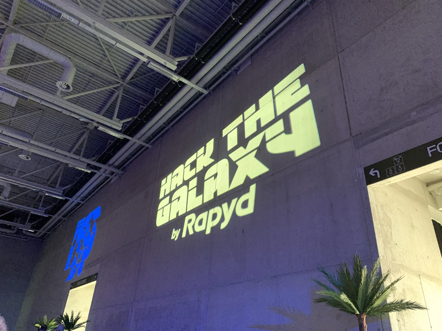 A wall projection saying Hack the Galaxy
