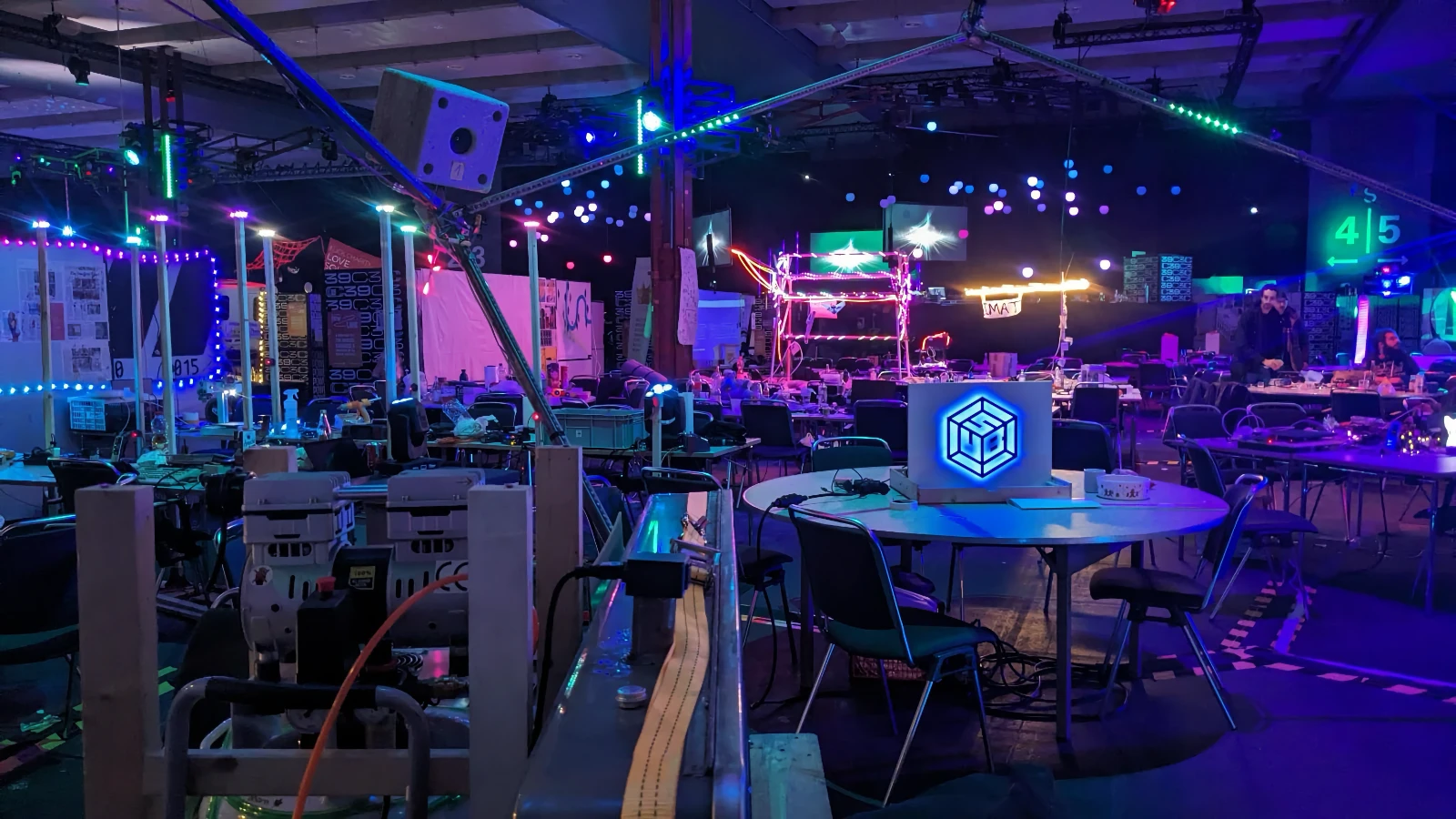 A hall of assemblies with equipment and chairs abandoned at night