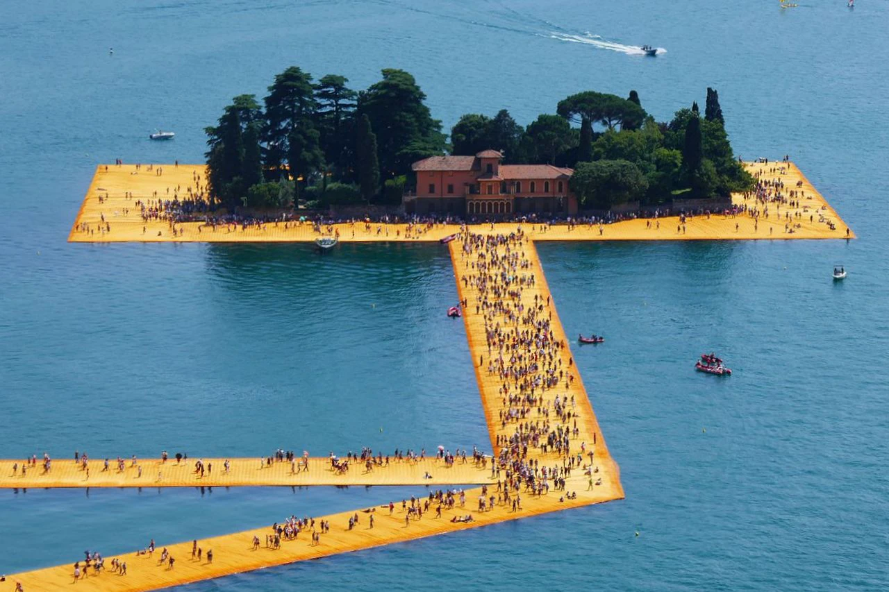 The Floating Piers installation by Christo and Jeanne-Claude, showing a walkway covered in yellow fabric over water