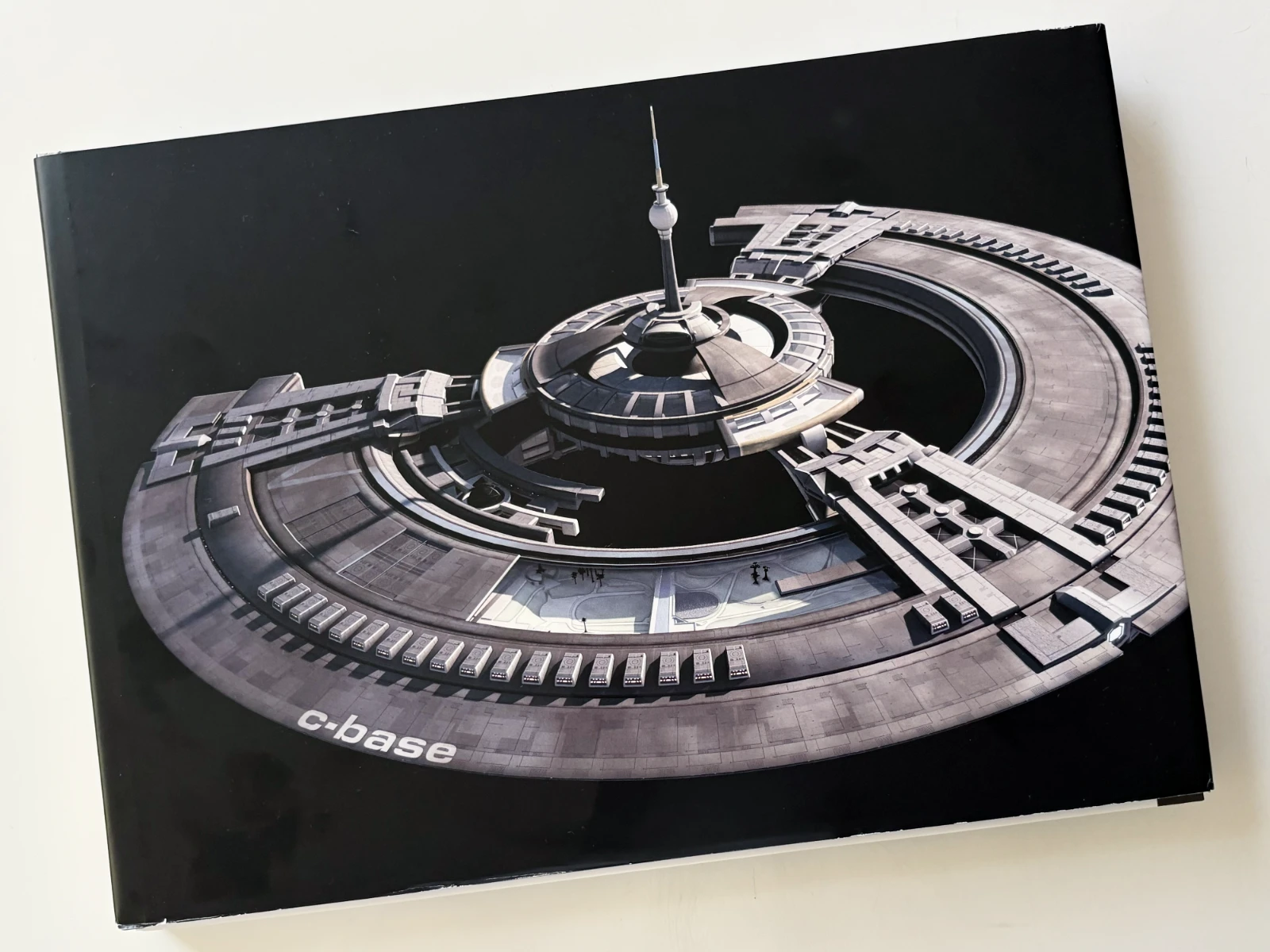 The cover of the book 'C-Booc: 20 Years C-Base' about the history of C-Base.