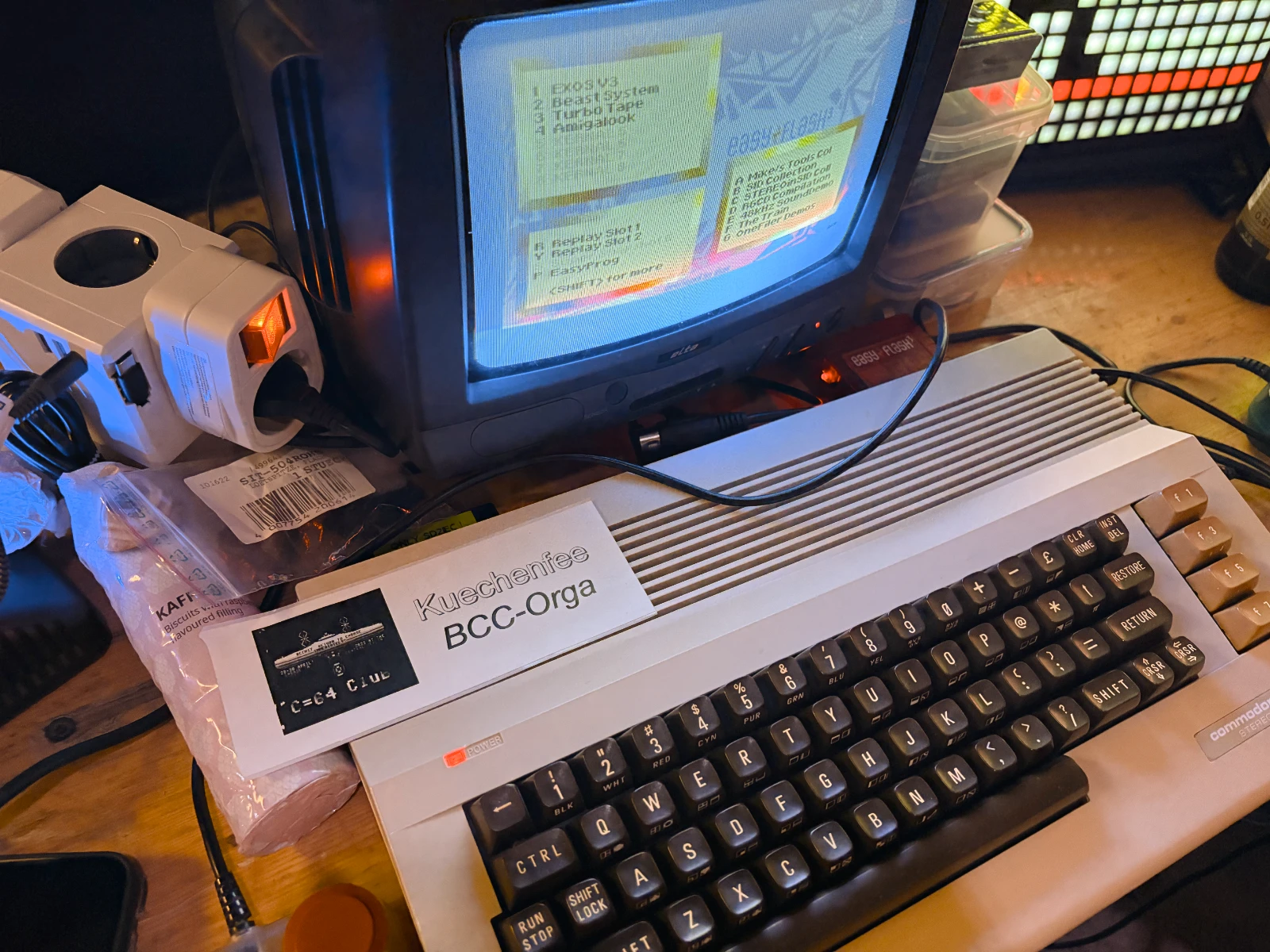 A C64 connected to a very small cathode ray tube TV.
