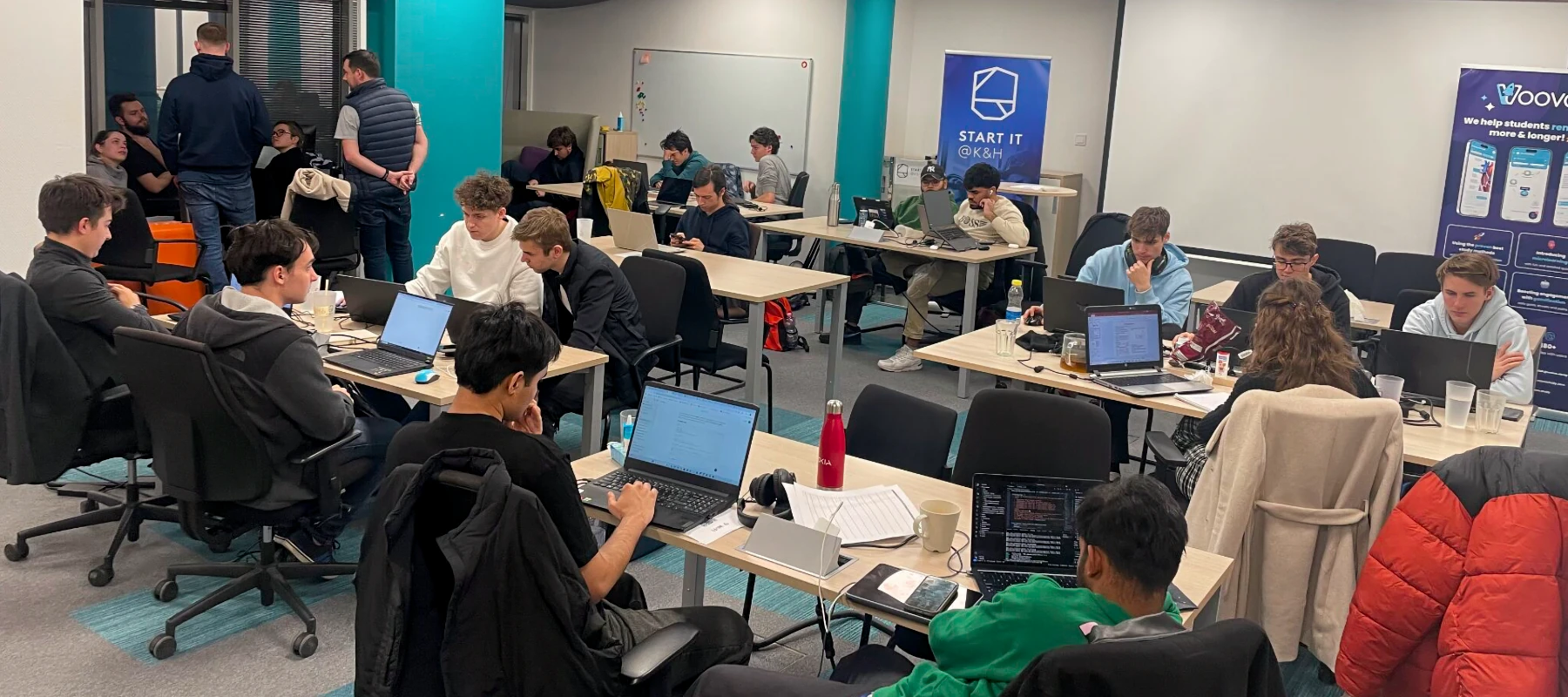 A group of participants working in the other of the rooms