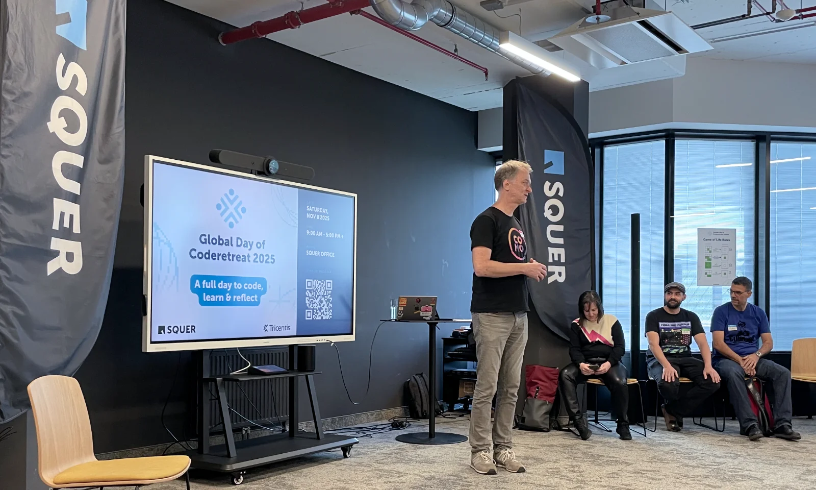 A tall blond man in his early fifties introduced the event