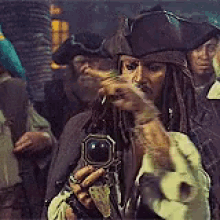 Animated GIF of Jack Sparrow holding a compass while looking confused.