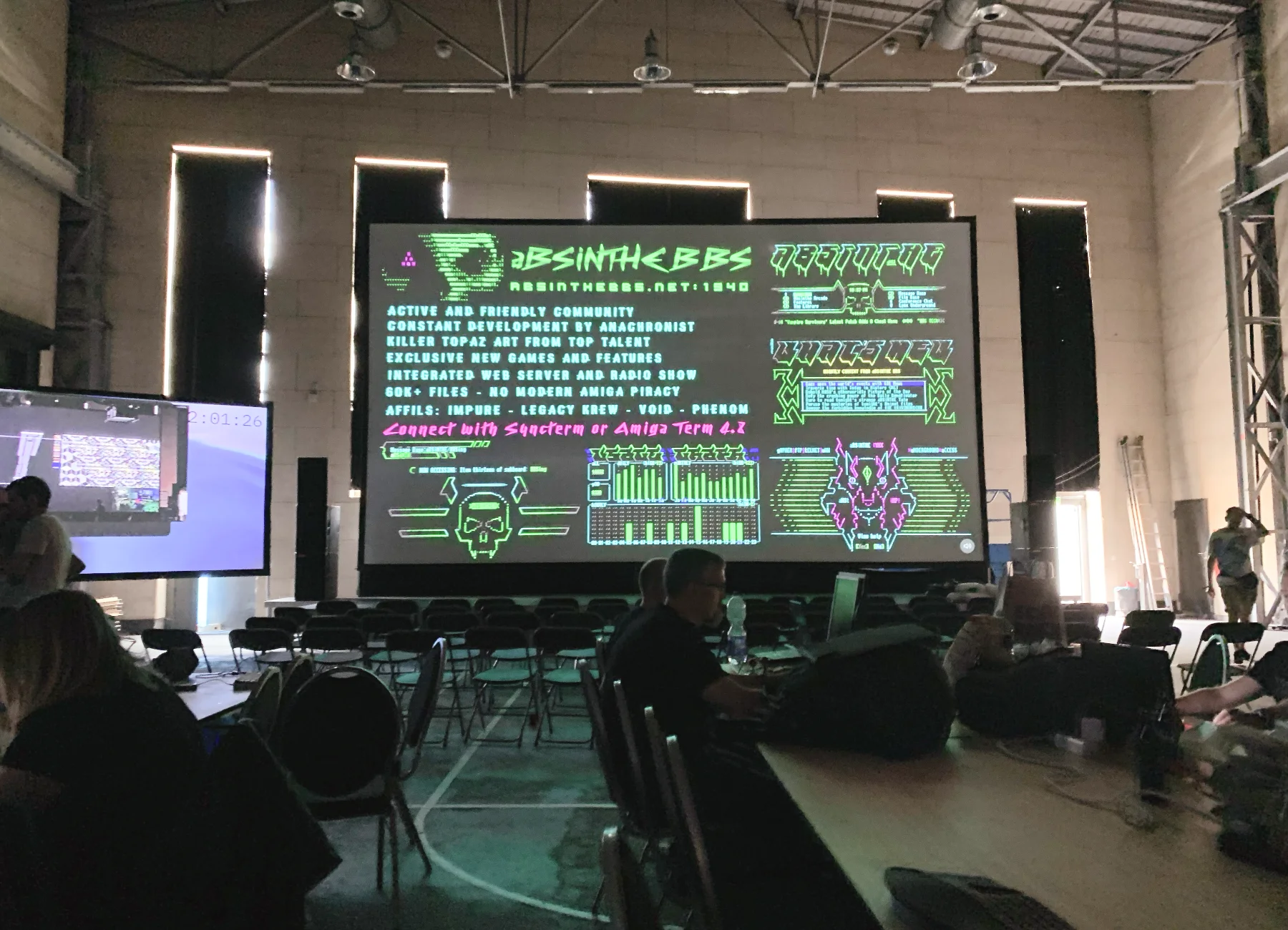 The main hall of the AbenteuerHallenKalk, filled with people and computer setups.