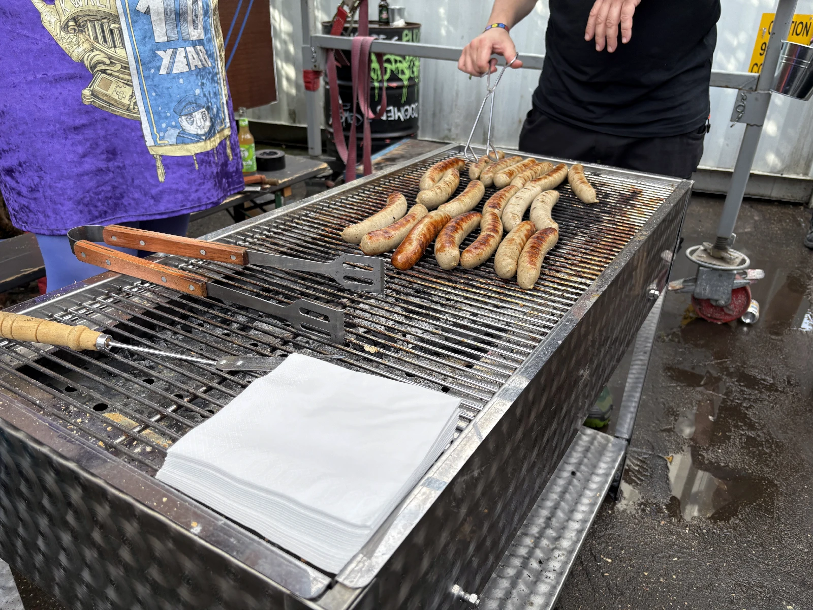 Sausages on the NARC barbecue after heavy rain.