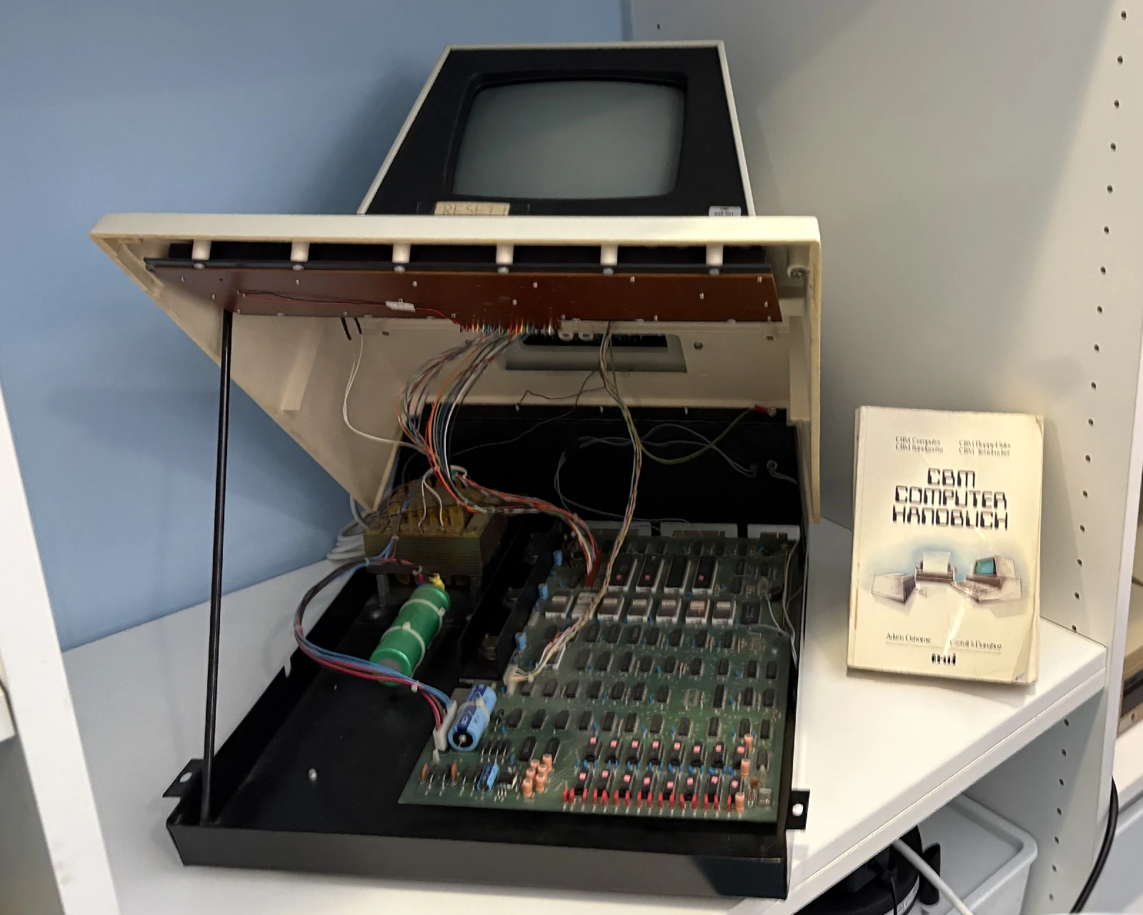 An opened Commodore PET showing its mainboard.
