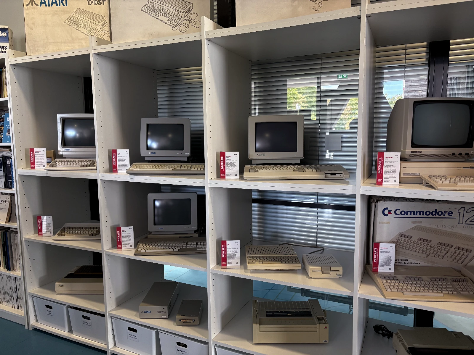 Vintage computers on display at the Computer Museum Cologne, including Commodore, Atari and Apple machines.