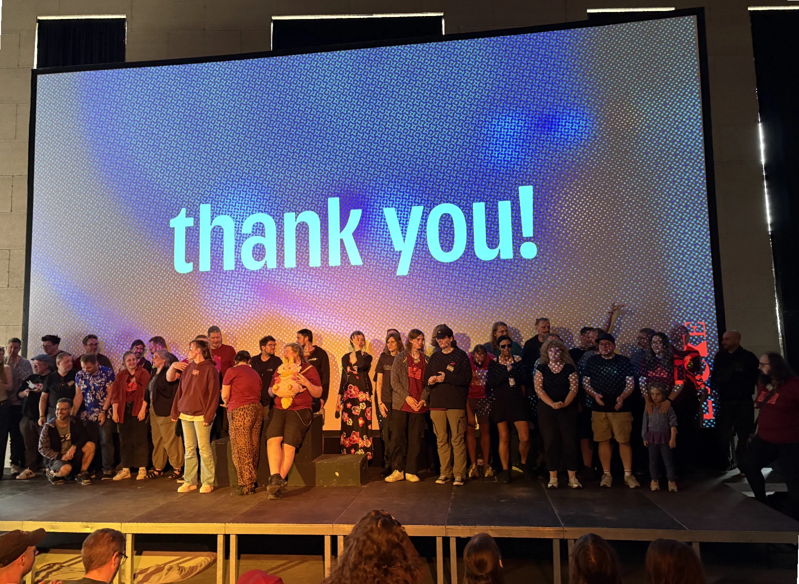The Evoke organizers on stage together at the end of the event.