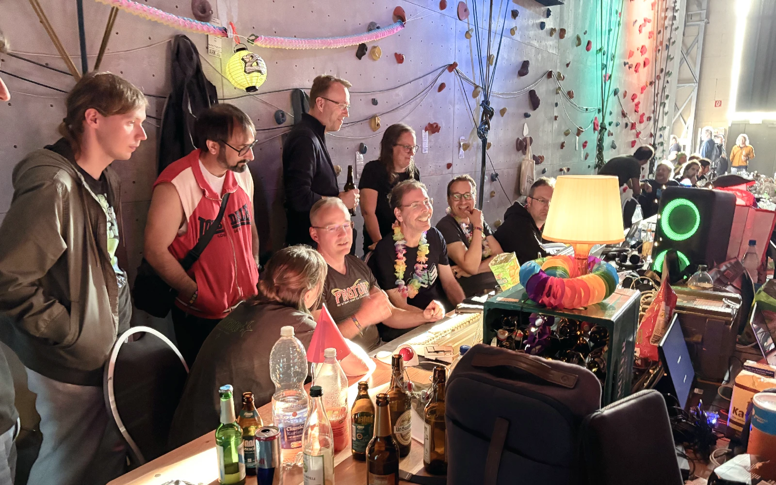 A group of sceners gathered in front of a Commodore Amiga, watching in wonder.