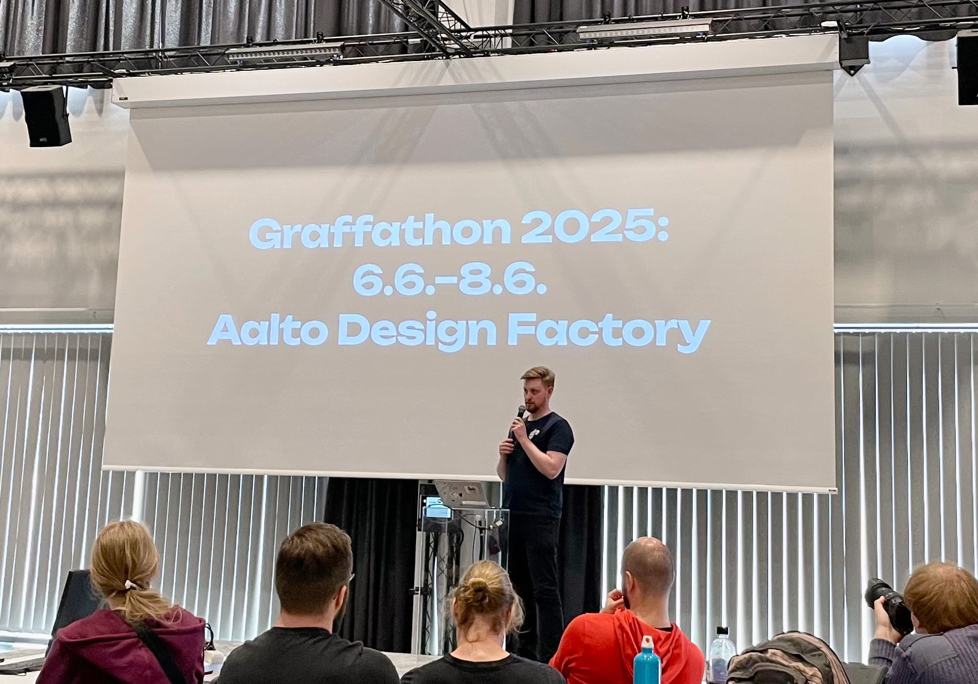 Felix on stage announcing Graffathon 2025