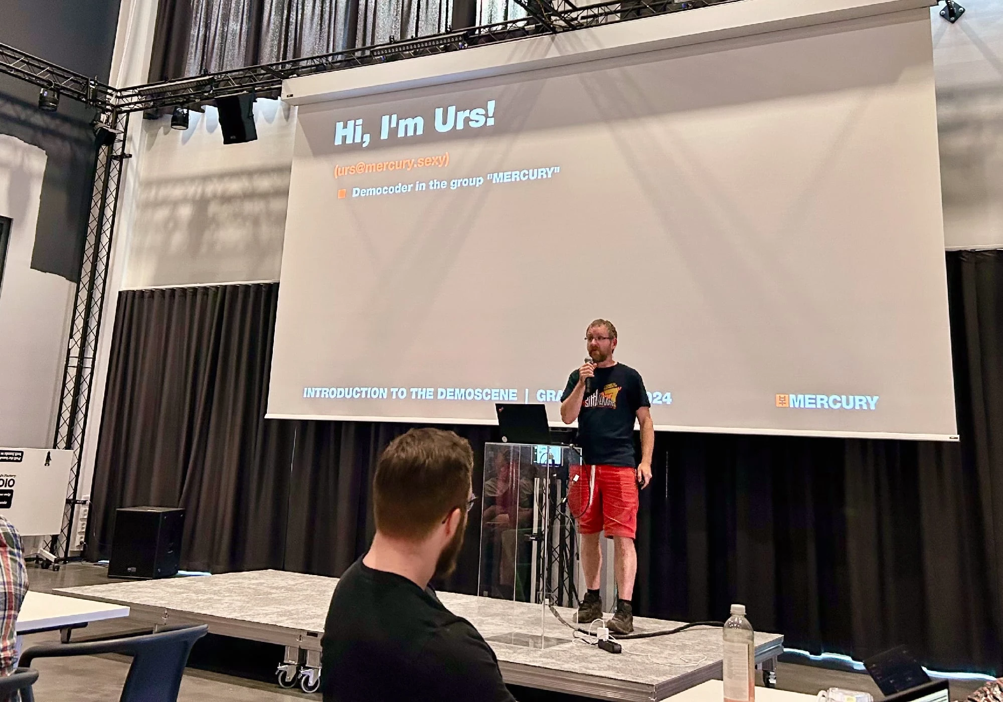 Urs presenting the demoscene's history and importance.