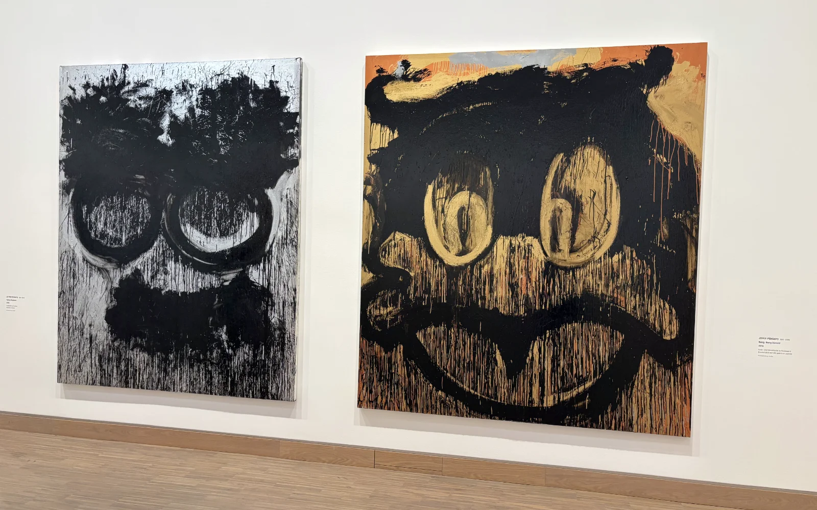 An expressive, charcoal-heavy painting of a cartoon face with dripping paint effects by Joyce Pensato.