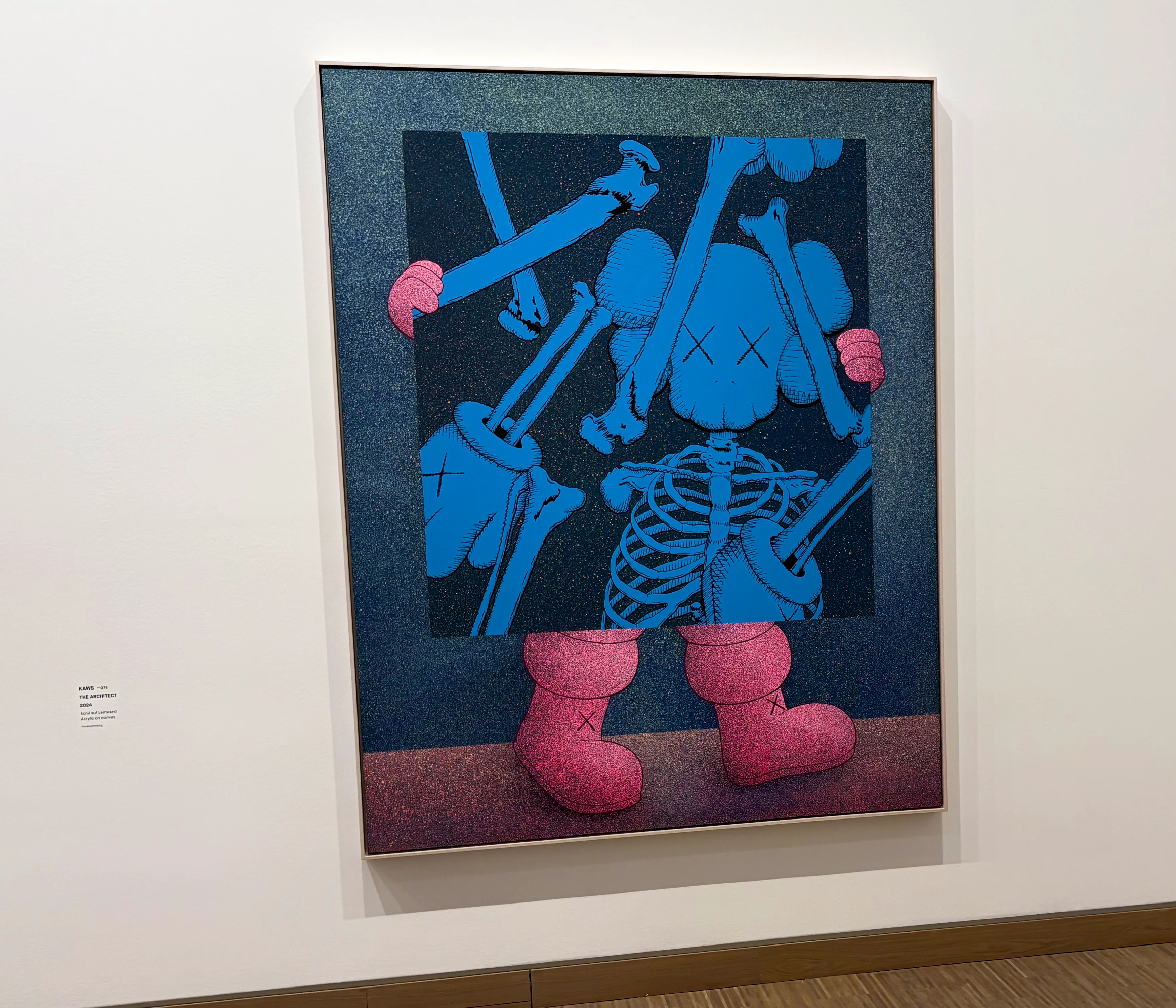 A large-scale KAWS sculpture titled 'The Architect' depicting a shattered COMPANION figure with a skeleton.