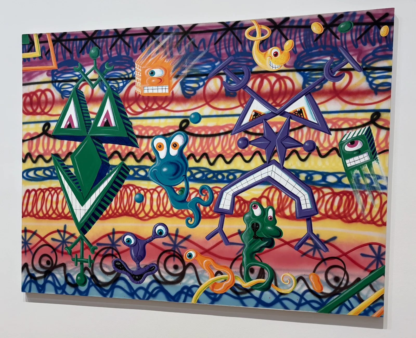 A vibrant, multi-colored painting by Kenny Scharf featuring smiling, amorphous comic-style faces.