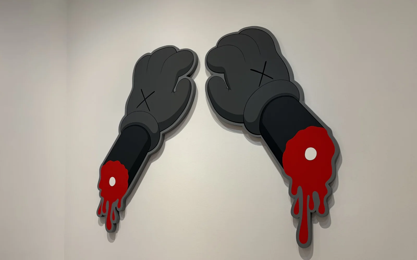 A painting of Mickey Mouse with exaggeratedly long arms reaching across the canvas.