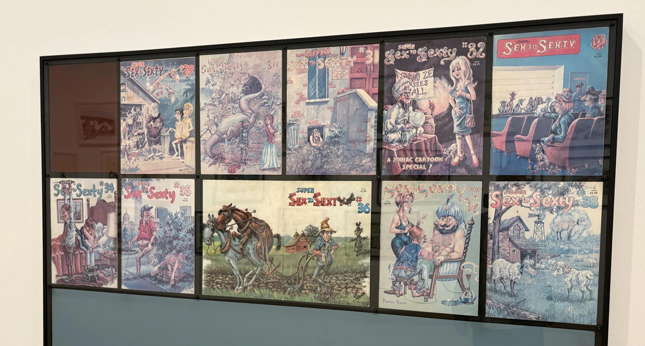 A glass display case containing vintage underground 'comix' magazines and literature.