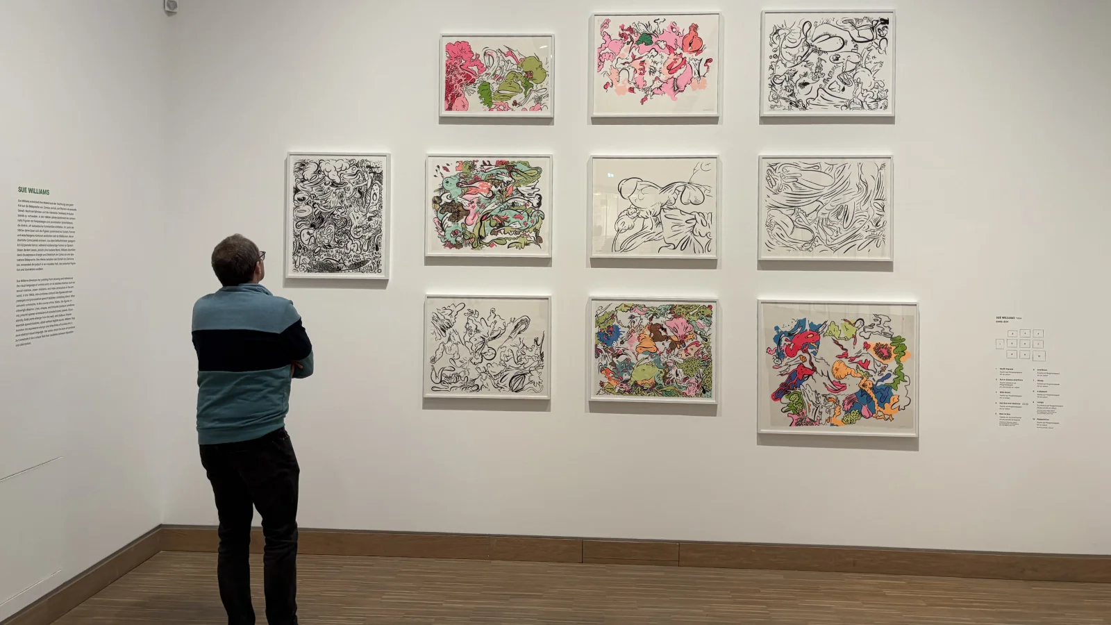 An abstract painting with swirling, organic lines and hidden comic-like figures by Sue Williams.