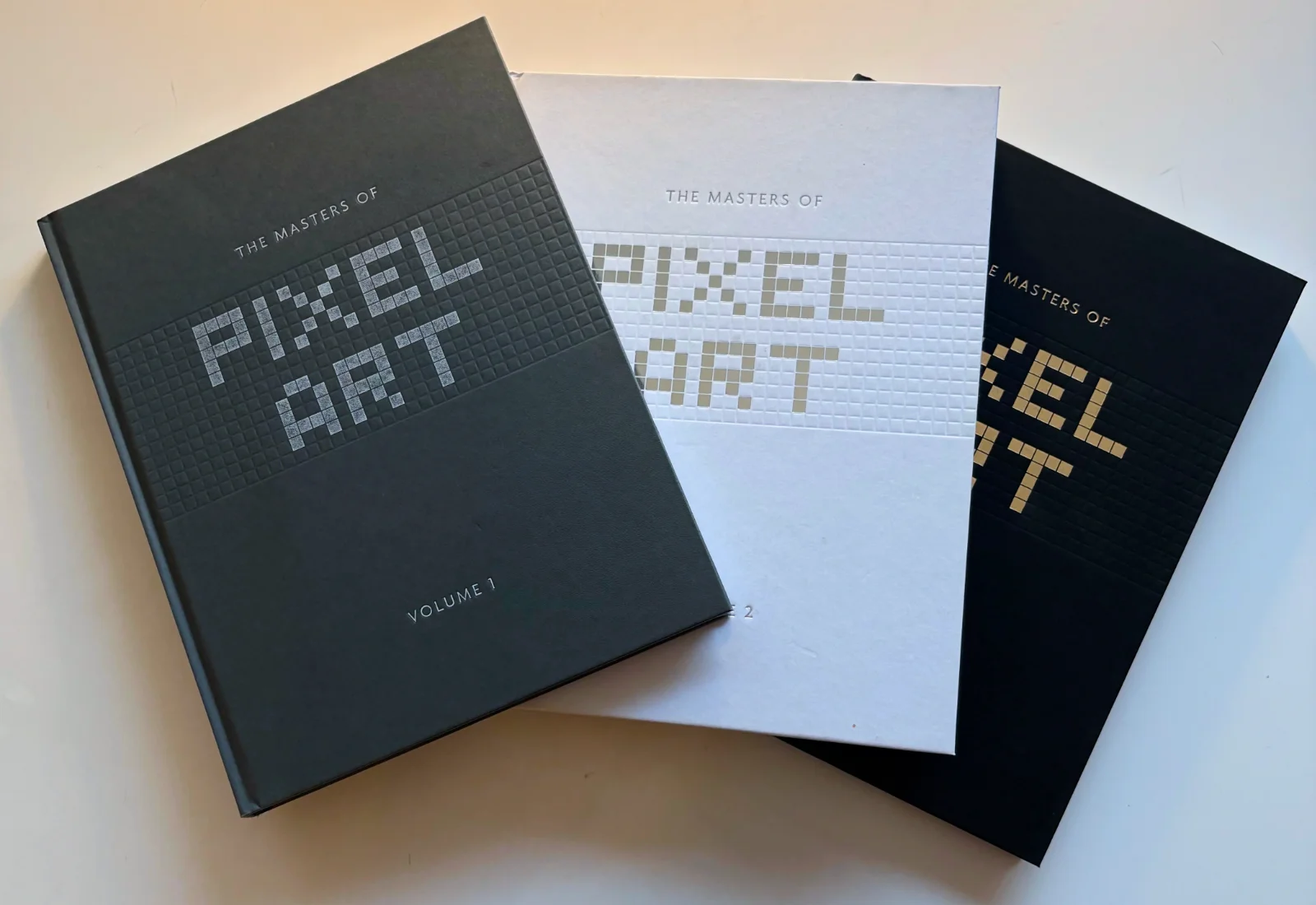 The three volumes of The Masters of Pixel Art book series.