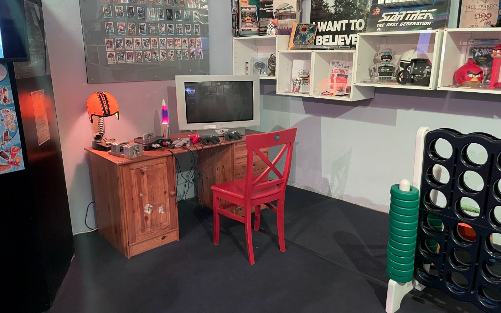 Living room setup with a Nintendo 64 and CRT TV.