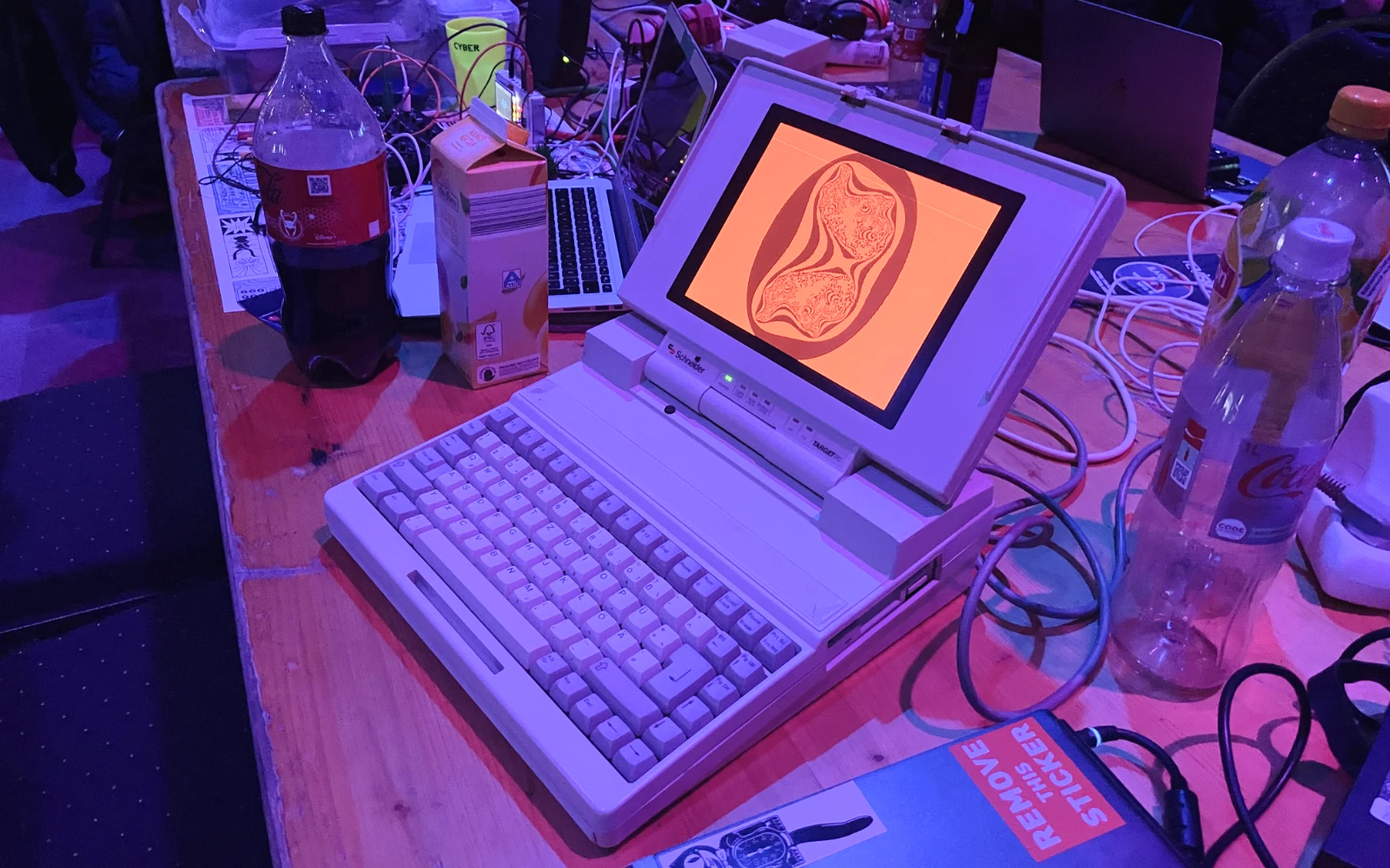 A vintage Schneider laptop with a distinctive retro display setup.