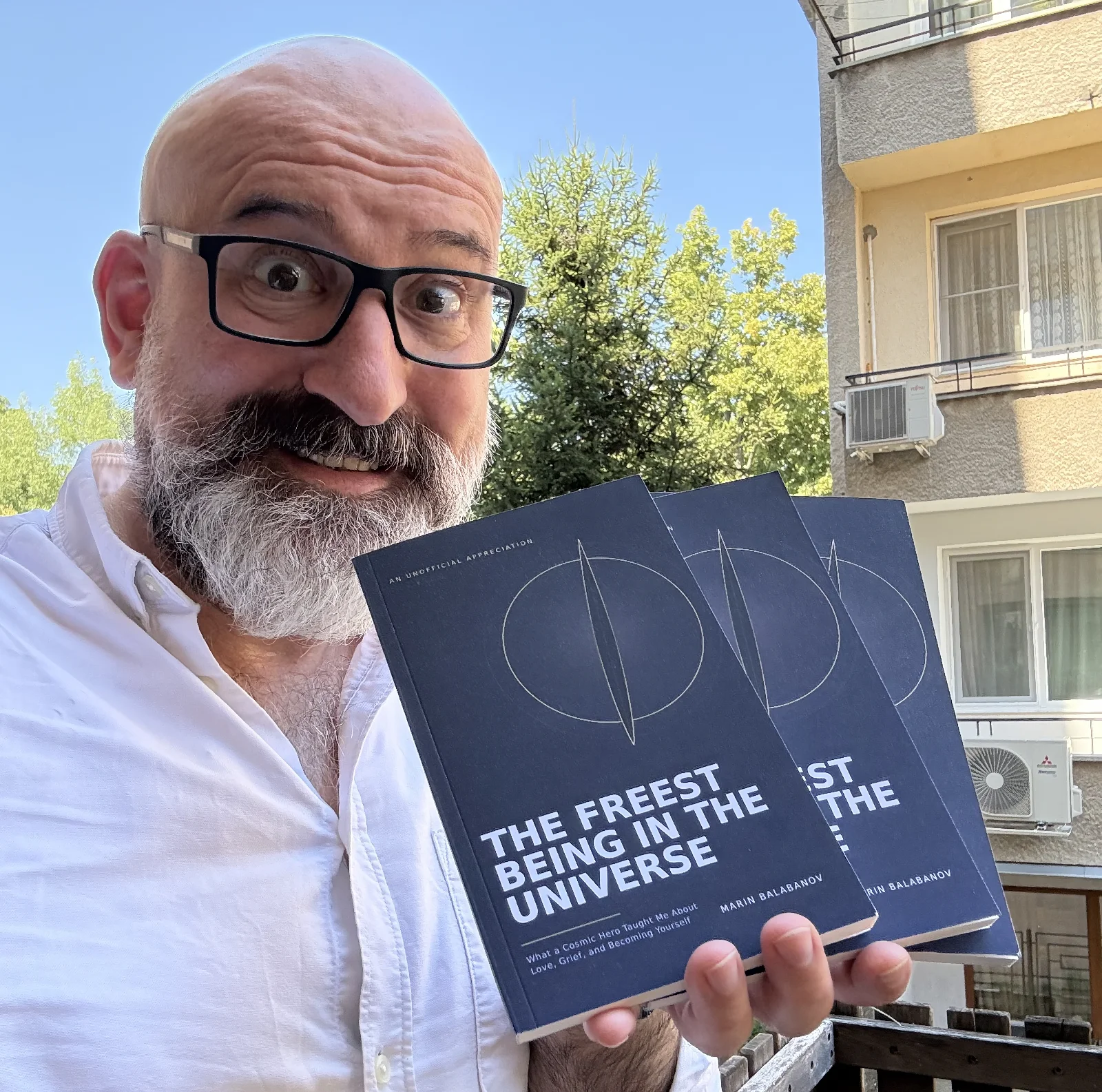 Marin Balabanov holding printed copies of The Freest Being in the Universe