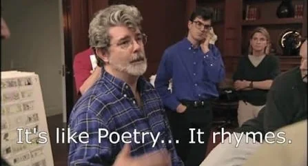 George Lucas, in a plaid shirt, gestures while talking to his crew in an office lined with storyboards, with the subtitle 'It's like Poetry... It rhymes.'